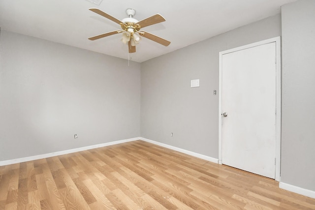 spare room with ceiling fan and light hardwood / wood-style flooring