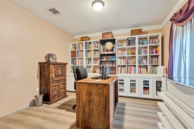 office featuring a textured ceiling, light hardwood / wood-style floors, and ornamental molding