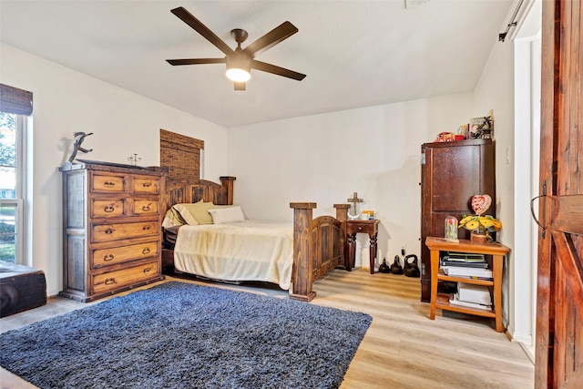 bedroom featuring ceiling fan and light hardwood / wood-style flooring