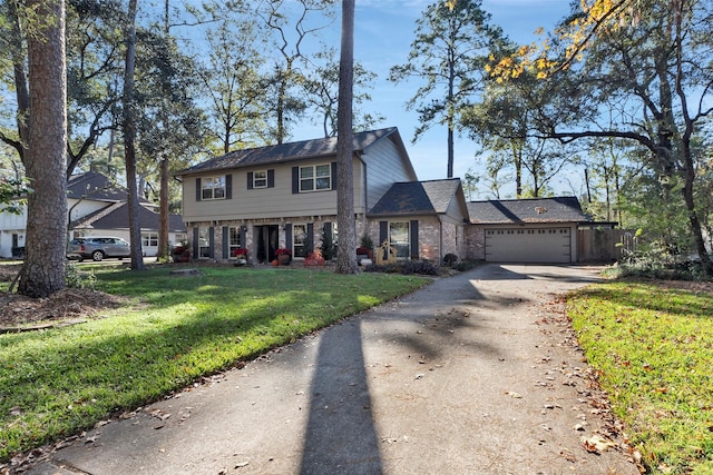 view of front of house featuring a front yard and a garage