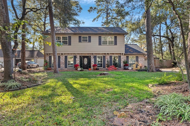 colonial inspired home with a front yard