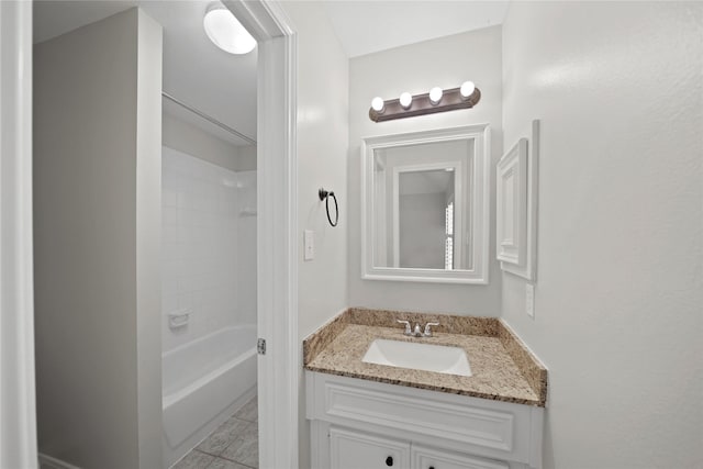 bathroom featuring vanity, tub / shower combination, and tile patterned floors