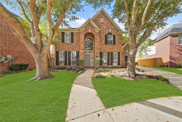 front facade with a front lawn