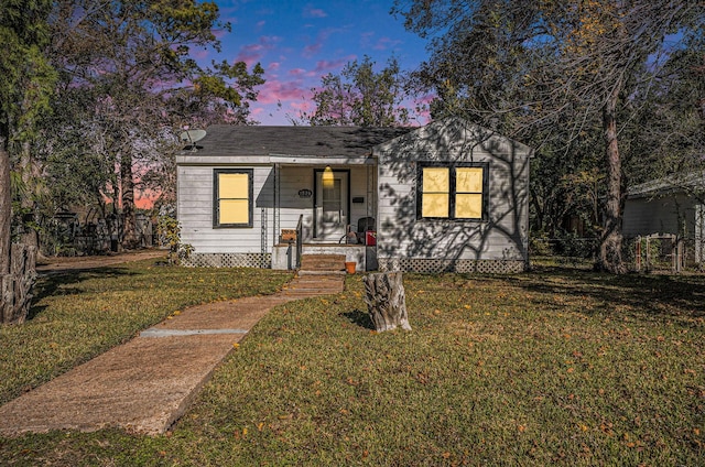 view of front of home featuring a yard