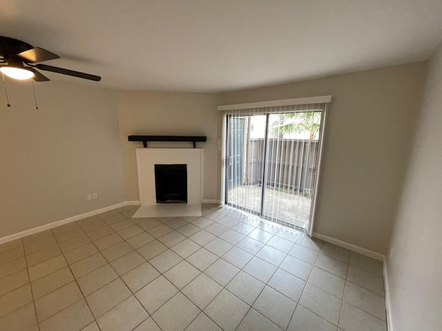 unfurnished living room with ceiling fan and light tile patterned floors