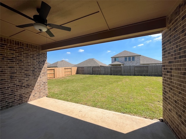 view of yard featuring a patio and ceiling fan