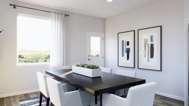 dining area with dark hardwood / wood-style floors and a healthy amount of sunlight