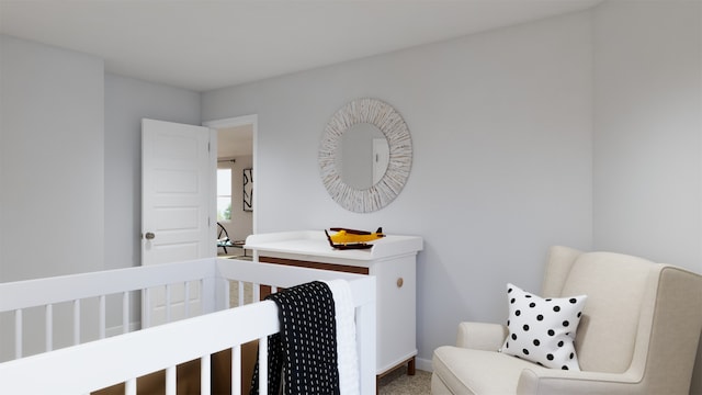 carpeted bedroom with a crib