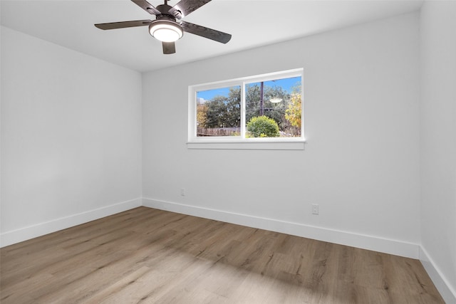 spare room featuring light wood-type flooring and ceiling fan