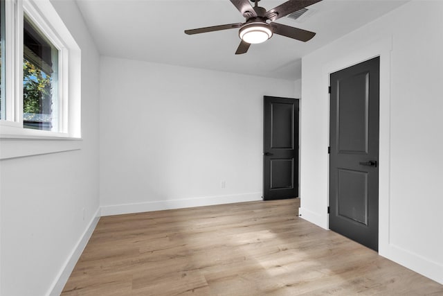 spare room with ceiling fan and light hardwood / wood-style flooring