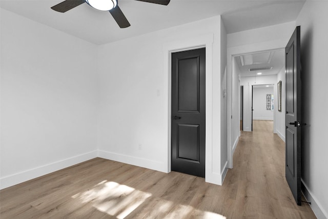 unfurnished room with ceiling fan and light hardwood / wood-style flooring