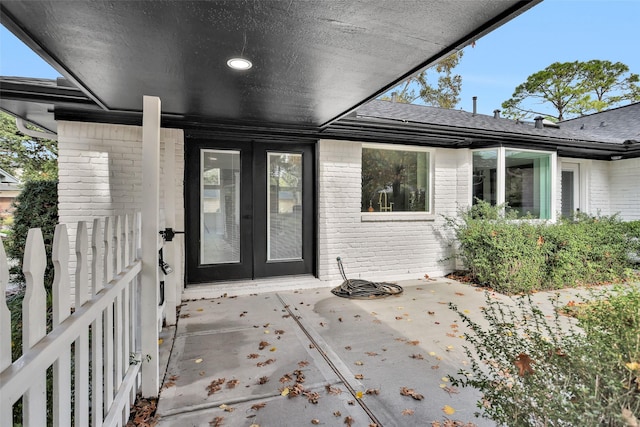 view of exterior entry featuring french doors