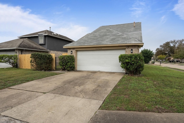 view of side of property featuring a yard and a garage