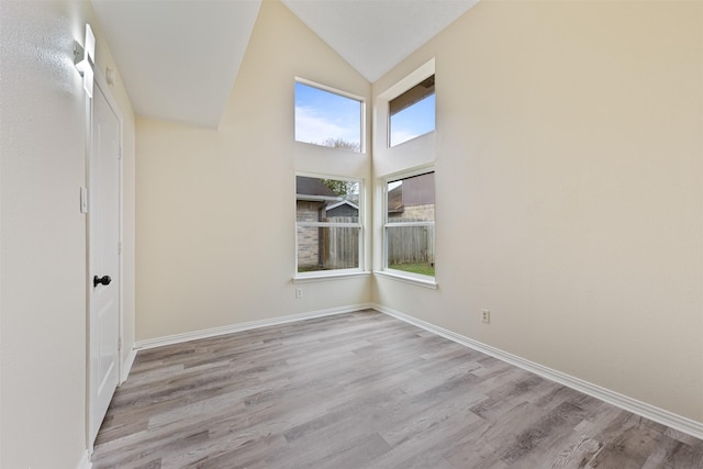 12406 S Rylander Cir, Houston, TX 77071 - spare room with lofted ceiling, wood finished floors, and baseboards