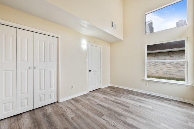 12406 S Rylander Cir, Houston, TX 77071 - unfurnished bedroom with wood finished floors, baseboards, and a closet