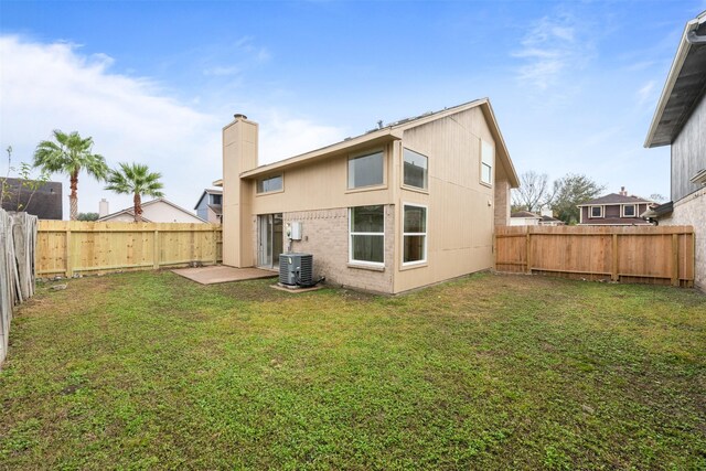 12406 S Rylander Cir, Houston, TX 77071 - back of house featuring a chimney and central AC