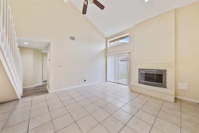 12406 S Rylander Cir, Houston, TX 77071 - unfurnished living room featuring high vaulted ceiling, a ceiling fan, light tile patterned floors, a brick fireplace, and baseboards