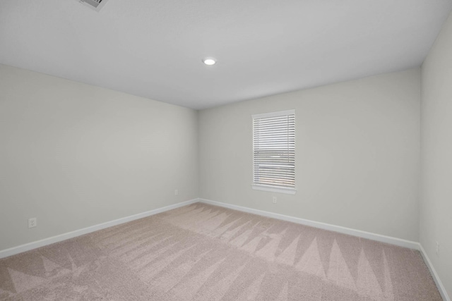 spare room with carpet floors