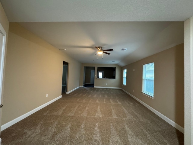 unfurnished living room with carpet flooring, ceiling fan, and lofted ceiling