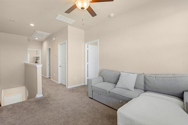 living room featuring ceiling fan and light colored carpet