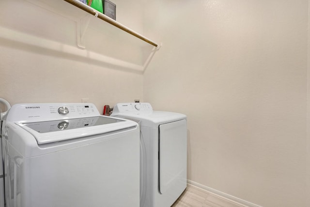 clothes washing area featuring washing machine and clothes dryer