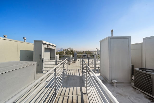 view of patio / terrace featuring central AC unit and a balcony