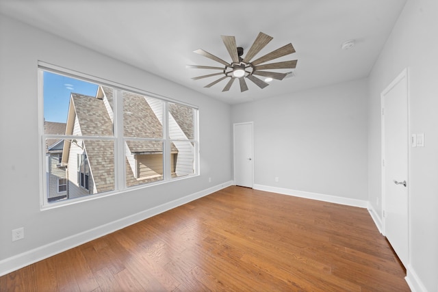 spare room with ceiling fan and hardwood / wood-style floors