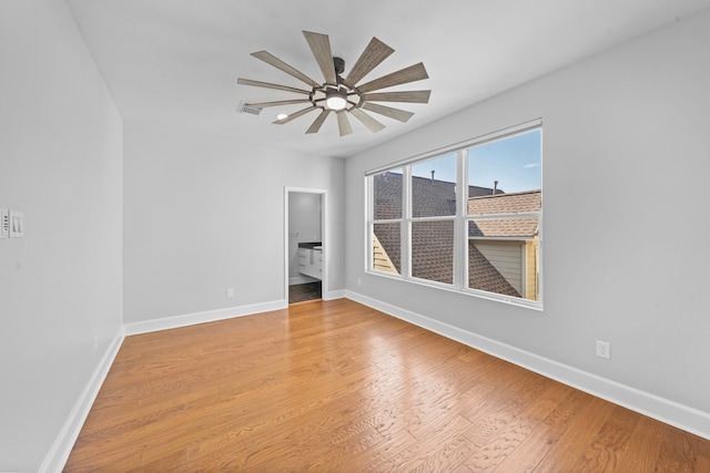 spare room with ceiling fan and light hardwood / wood-style flooring