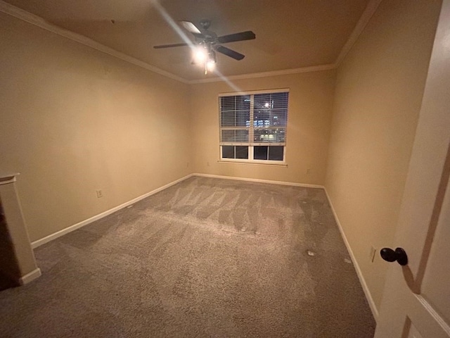 carpeted empty room featuring ceiling fan and ornamental molding