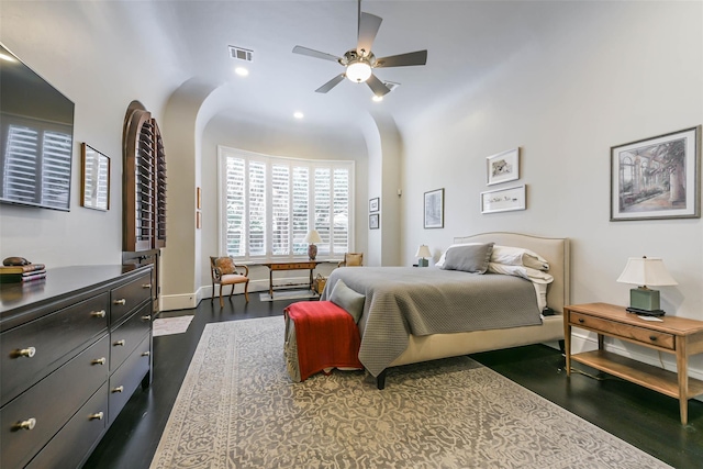 bedroom with ceiling fan and dark hardwood / wood-style floors