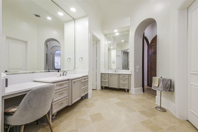 bathroom featuring tile patterned flooring and vanity