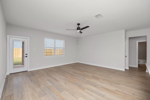 empty room featuring ceiling fan and light hardwood / wood-style floors