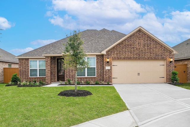 view of front of home with a front lawn and a garage