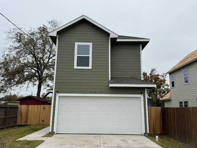 view of front of property featuring a garage