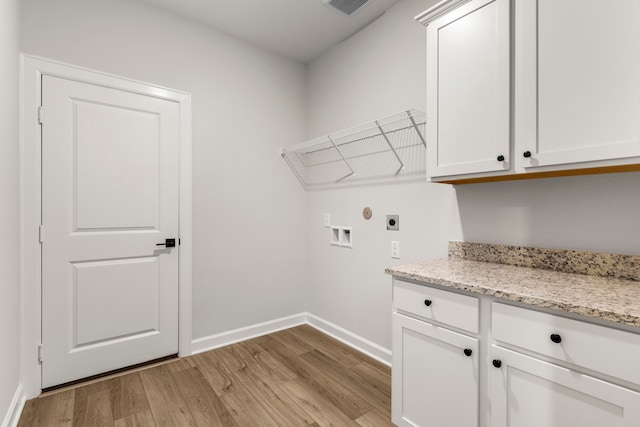 laundry area featuring electric dryer hookup, cabinets, light wood-type flooring, and hookup for a washing machine