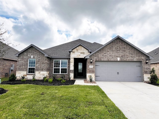 view of front of property with a garage and a front lawn