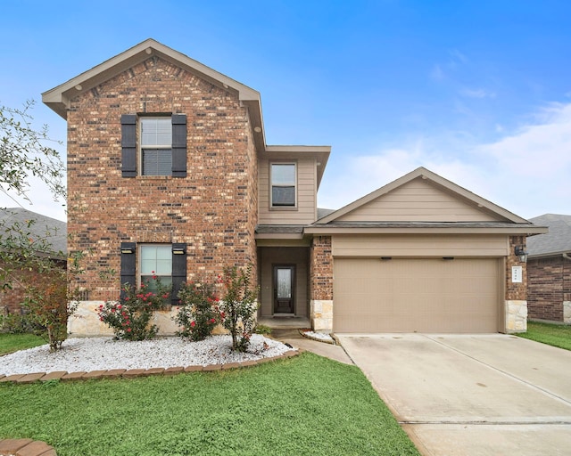 front of property featuring a front yard and a garage