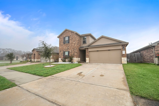 view of front of home with a garage and a front lawn