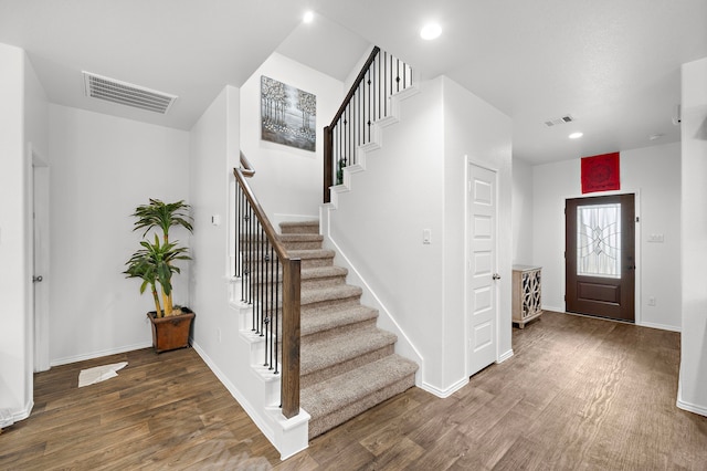 foyer entrance featuring dark hardwood / wood-style flooring