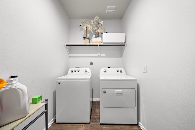 washroom featuring separate washer and dryer and dark hardwood / wood-style floors