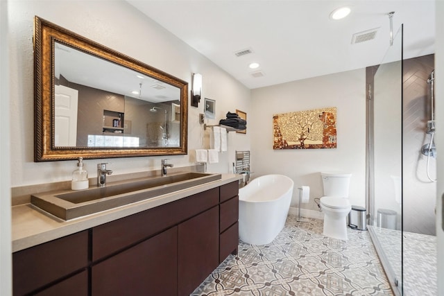 bathroom featuring a stall shower, a soaking tub, and visible vents