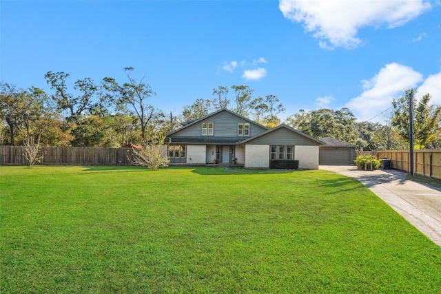 back of property featuring a yard and a garage