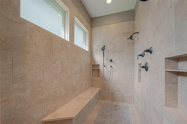 bathroom featuring tiled shower