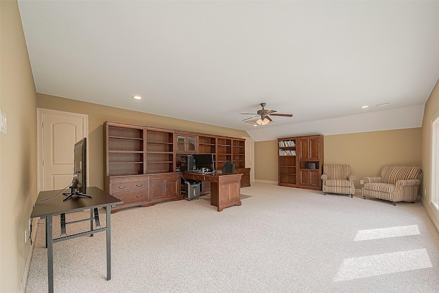 carpeted office space featuring ceiling fan