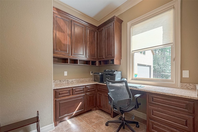 office area featuring light tile patterned floors and built in desk