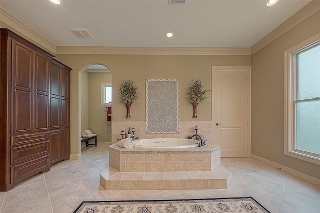 bathroom featuring ornamental molding, tiled bath, tile patterned floors, and a healthy amount of sunlight