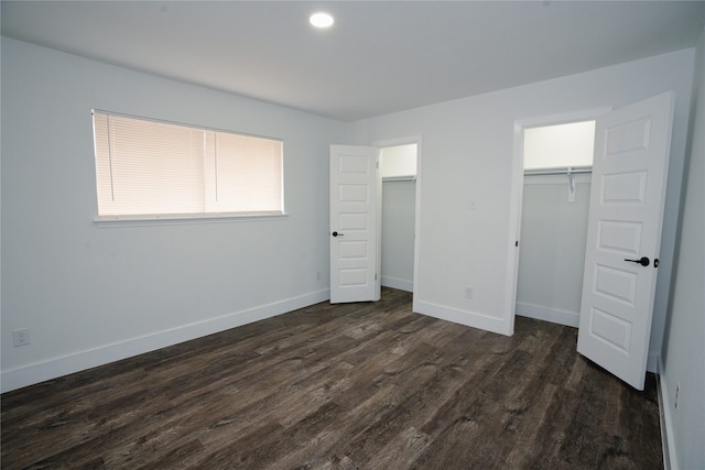 unfurnished bedroom featuring dark hardwood / wood-style flooring