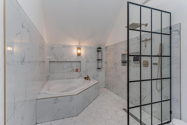 bathroom featuring separate shower and tub, tile patterned floors, and lofted ceiling