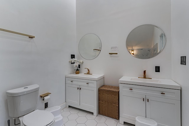 bathroom featuring tile patterned flooring, vanity, and toilet