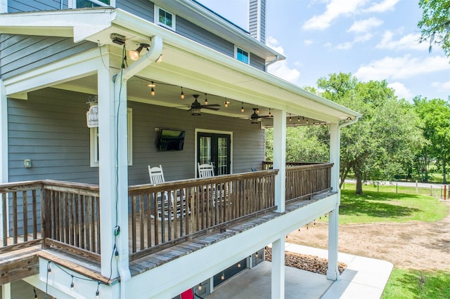 wooden deck with ceiling fan